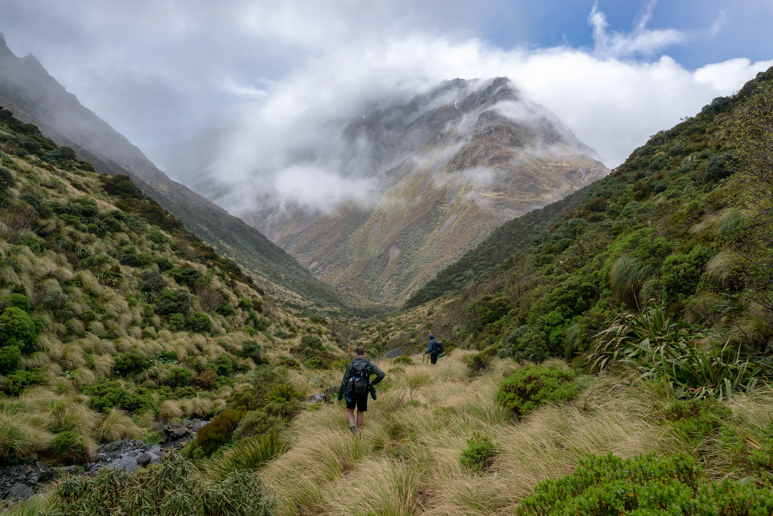 Descending the stream gorge from Tarn Col, with Pt 1742 looming large in the dramatic cloud