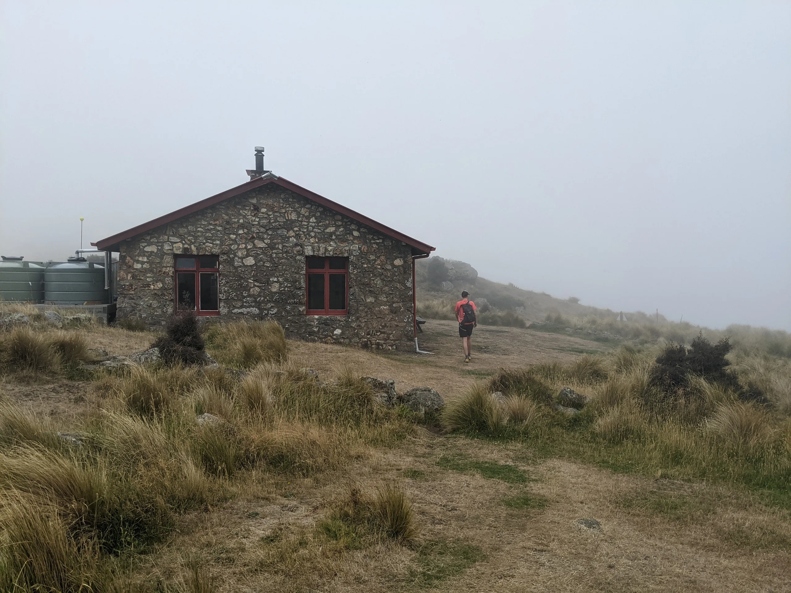 Packhorse Hut in the low cloud. Good to stop for a snack and to top up the water supplies.